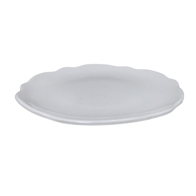 Plato para postre Scallop de 7.5 pulgadas en color blanco, con forma circular, bordes ondulados decorativos y acabado brillante.